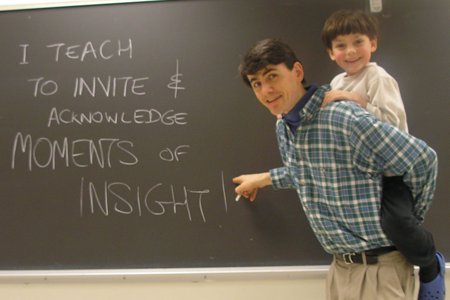 "why I teach" photo - professor at the blackboard